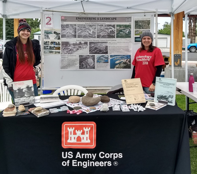 Corps staff at their booth at a past Archaeology Roadshow event.