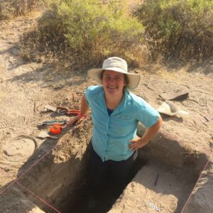 Jordan Pratt standing in an excavation unit