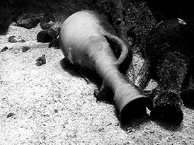 an Amphora underwater in the sand